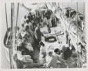 Image of Group on deck at Siorapudoo gathered around recorder